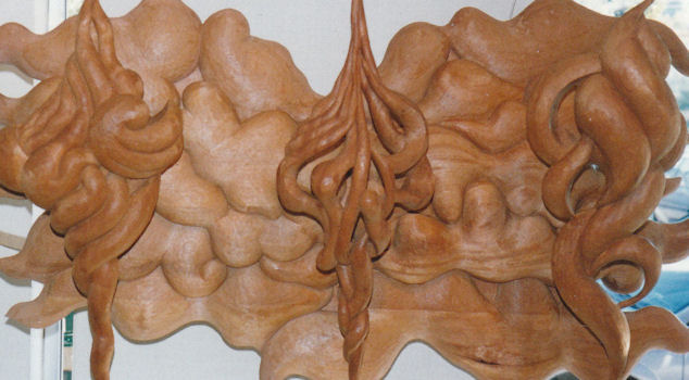Wood carving sculture titled Triangle, personal wood art collection, Will residence, wood carver Jude Fritts
